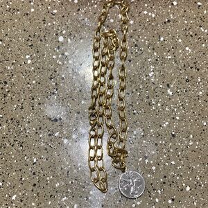 14k gold bale connected to a real Italian coin